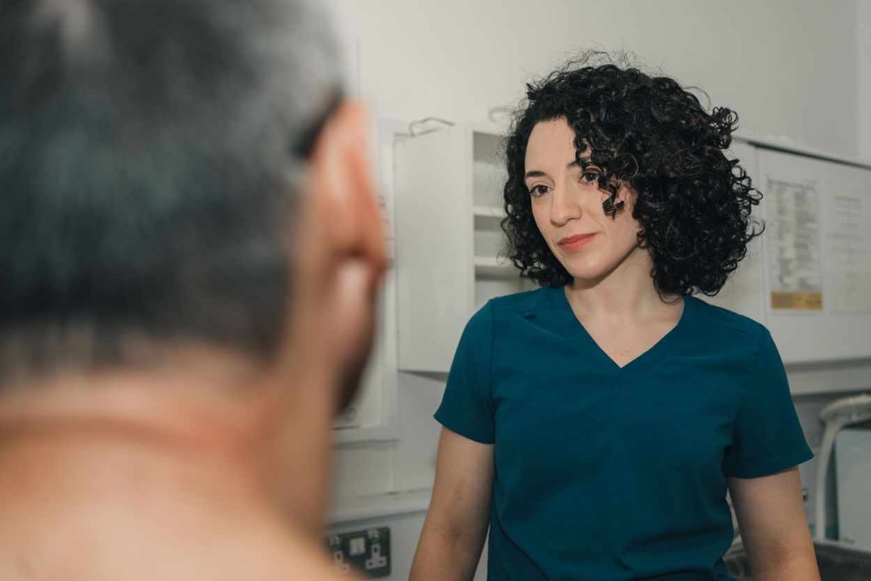 Dentist talking with a patient at Green Park Dental in Bath